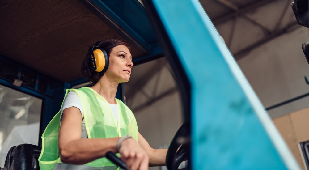 woman-forklift-operator-driving-vehicle-picture-id1141043704