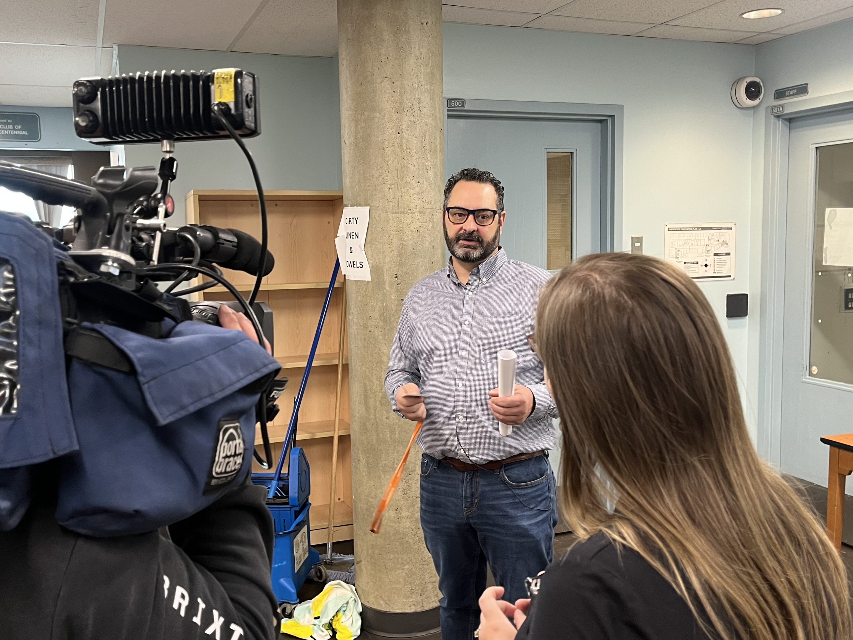 DI leader speaking with reporter of Global News